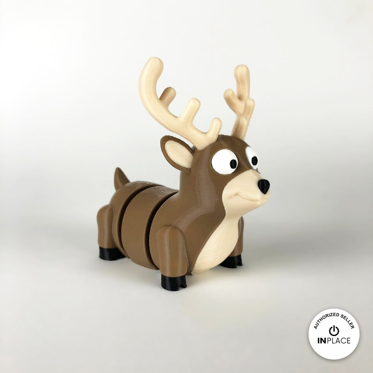 Cute reindeer keychain, 3D printed by RU3D – three quarter view facing right. Brown with cream antlers and chest.
