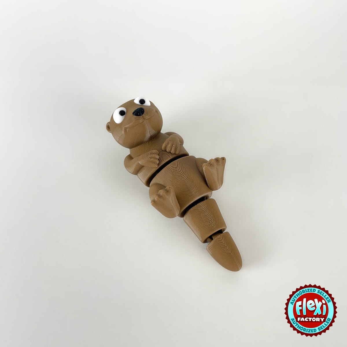 Cute river otter keychain, 3D printed by RU3D – floating on back diagonal view. Brown with cream belly.