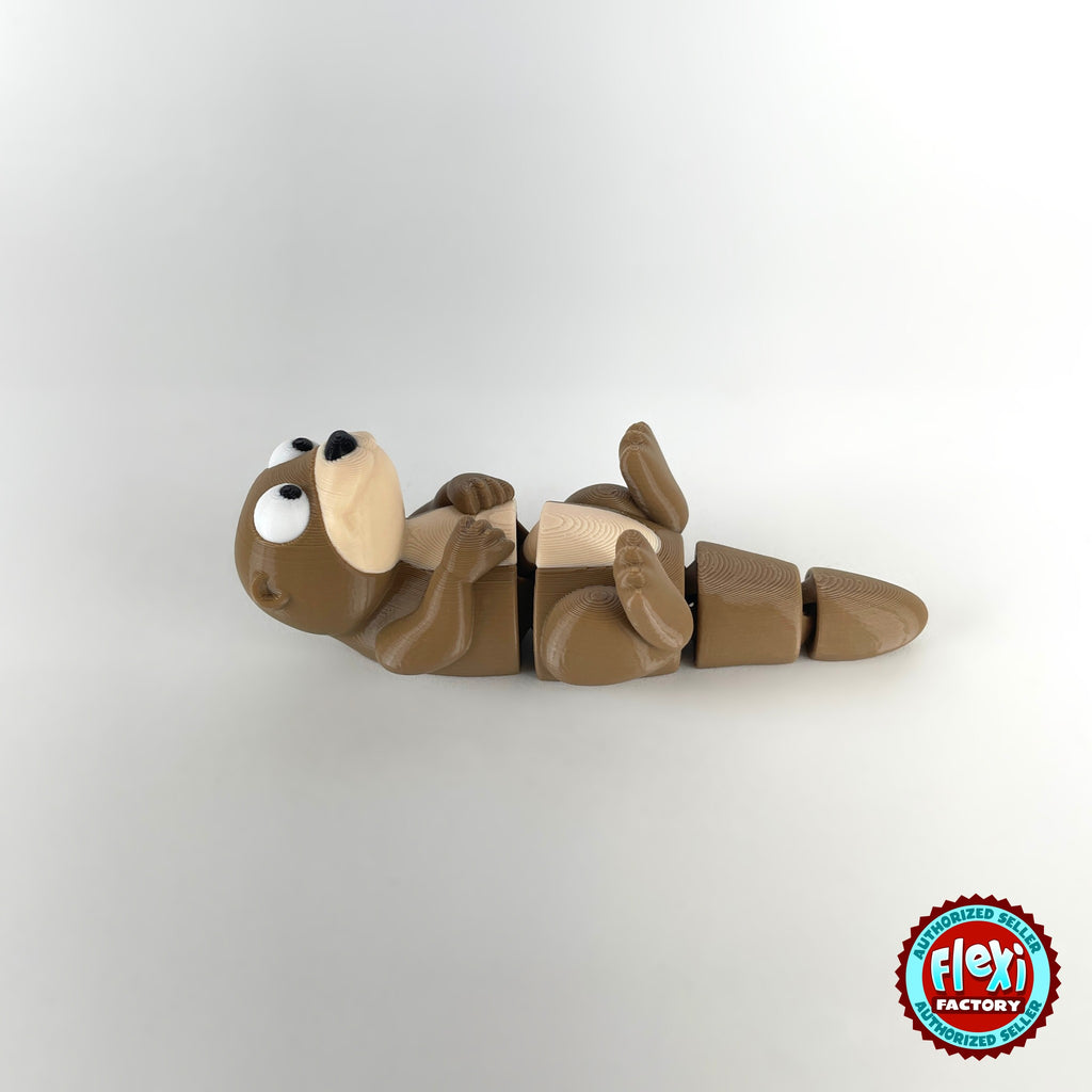 Cute river otter keychain, 3D printed by RU3D – lying on back facing left. Brown with cream belly.
