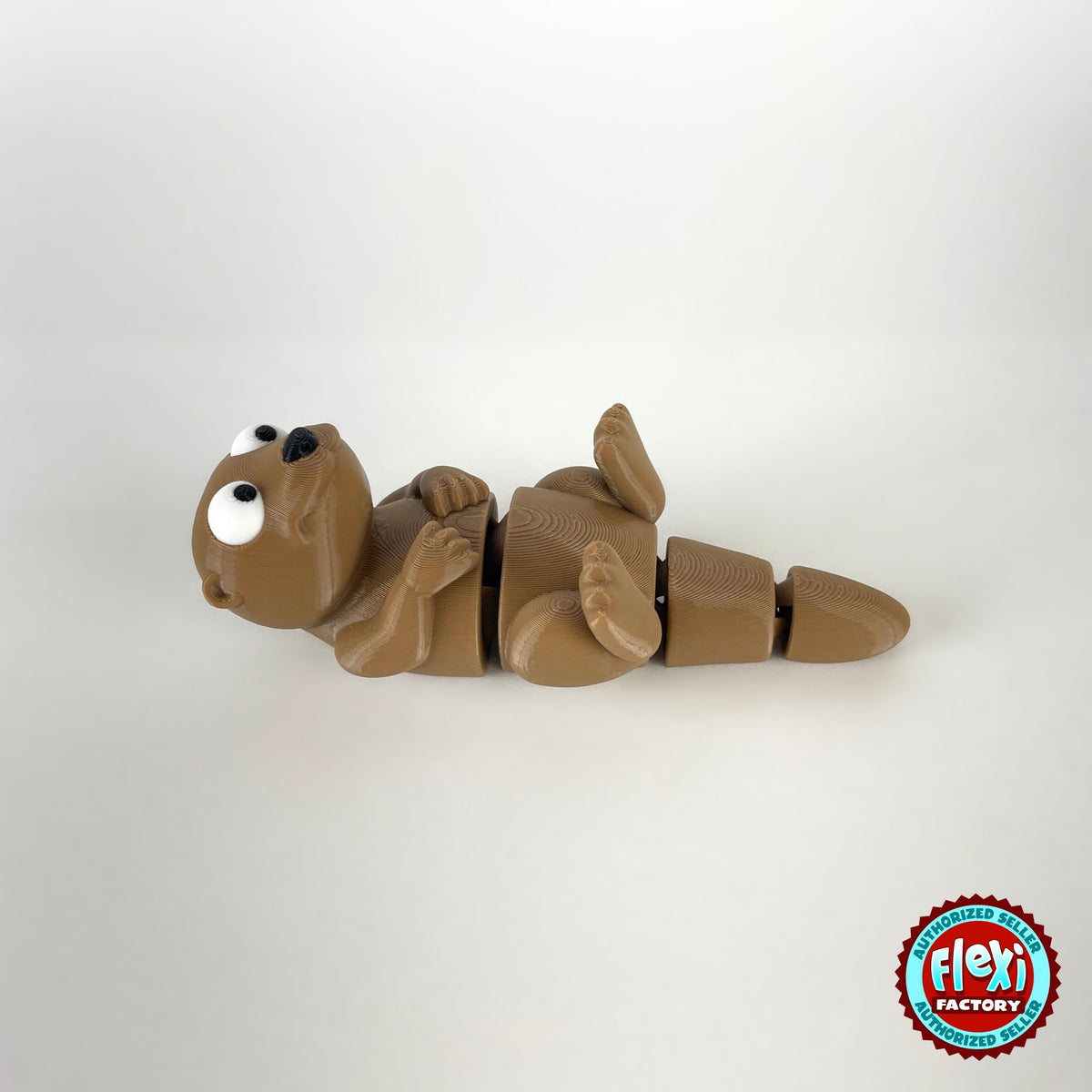 Cute river otter keychain, 3D printed by RU3D – lying on back side view. Brown with cream belly.