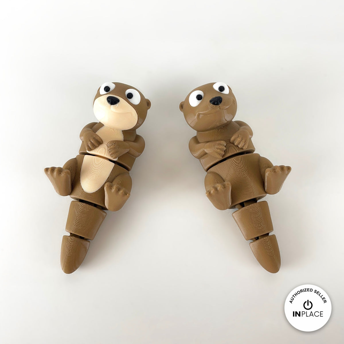 Cute river otter keychain, 3D printed by RU3D – pair of otters floating on back. Brown with cream belly.