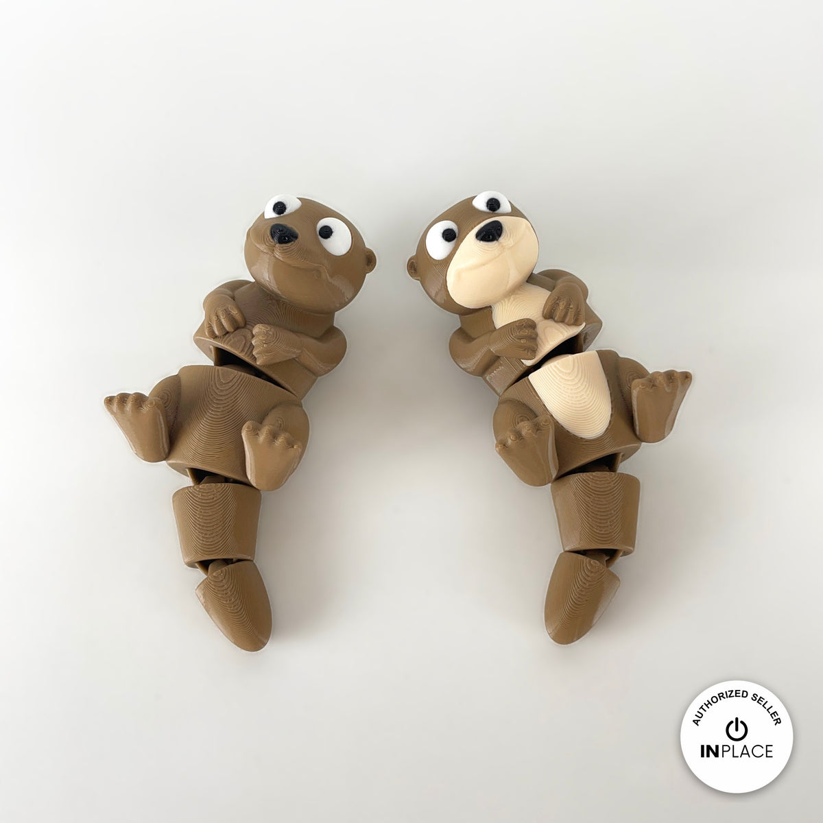 Cute river otter keychain, 3D printed by RU3D – pair of otters top view. Brown with cream belly.