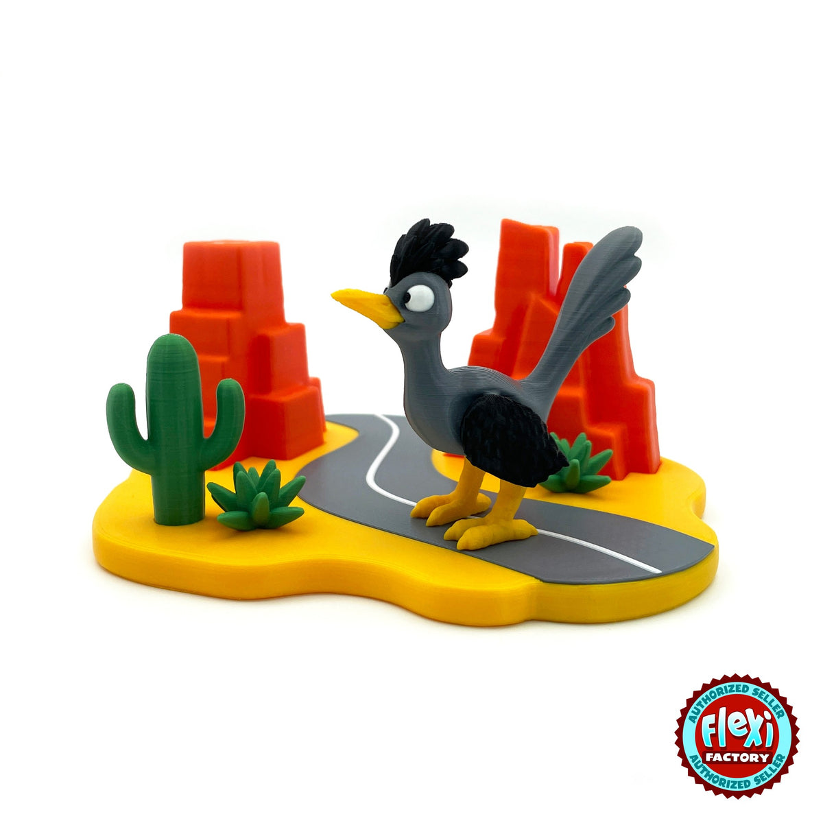 Cute road runner keychain, 3D printed by RU3D – on desert highway playset. Grey and black bird with desert highway playset.