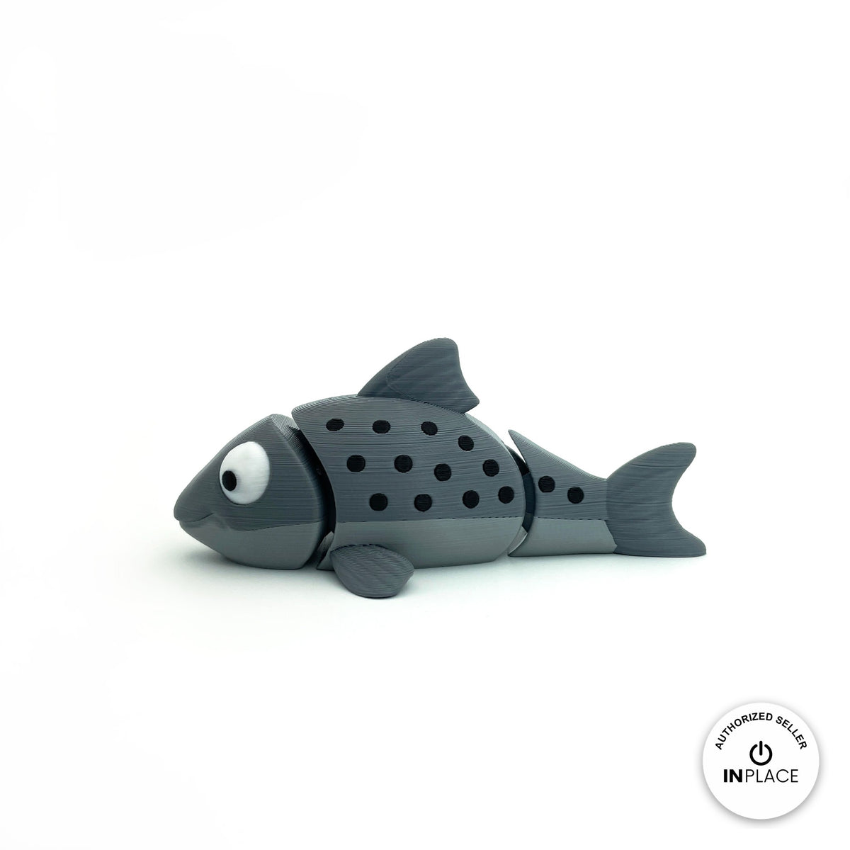 Cute salmon fish keychain, 3D printed by RU3D – grey salmon side view facing left. Red and grey with black spots, also all grey.