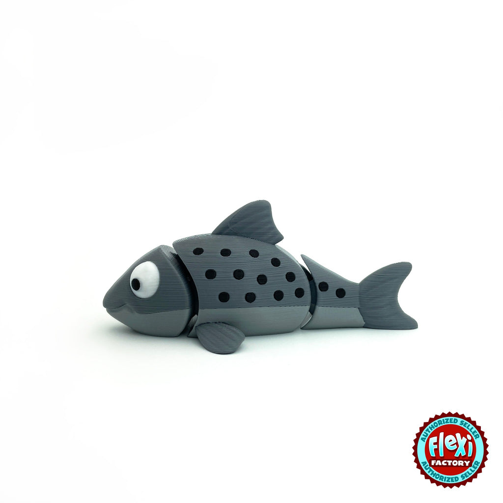 Cute salmon fish keychain, 3D printed by RU3D – grey salmon side view facing left. Red and grey with black spots, also all grey.