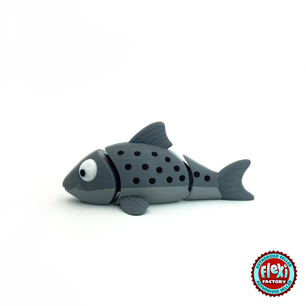 Cute salmon fish keychain, 3D printed by RU3D – grey salmon side view facing left. Red and grey with black spots, also all grey.