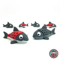 Cute salmon fish keychain, 3D printed by RU3D – group of salmon. Red and grey with black spots, also all grey.