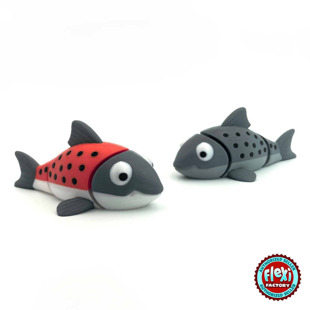 Cute salmon fish keychain, 3D printed by RU3D – red and grey salmon pair. Red and grey with black spots, also all grey.
