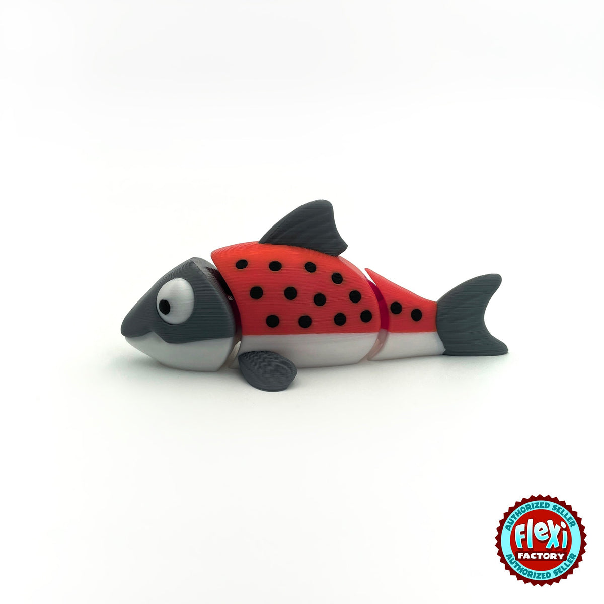 Cute salmon fish keychain, 3D printed by RU3D – red salmon side view facing left. Red and grey with black spots, also all grey.