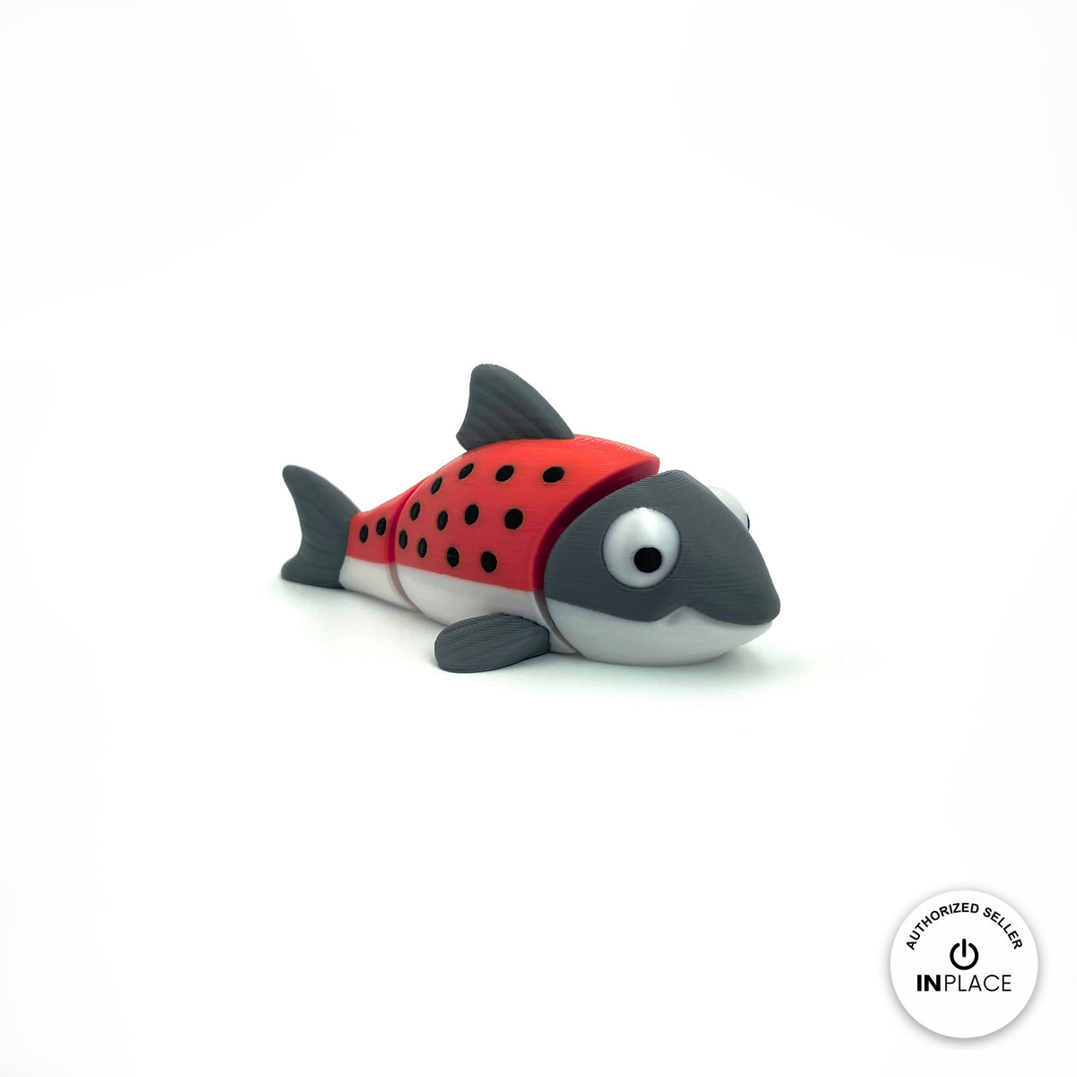 Cute salmon fish keychain, 3D printed by RU3D – red salmon three quarter view facing right. Red and grey with black spots, also all grey.