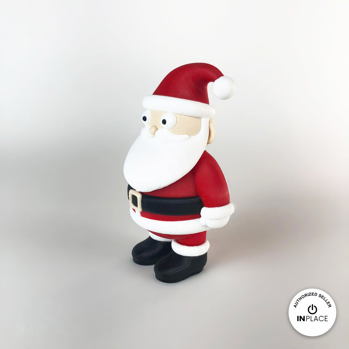 Cute Santa claus keychain, 3D printed by RU3D – side view facing left. Red suit with white beard and black boots.
