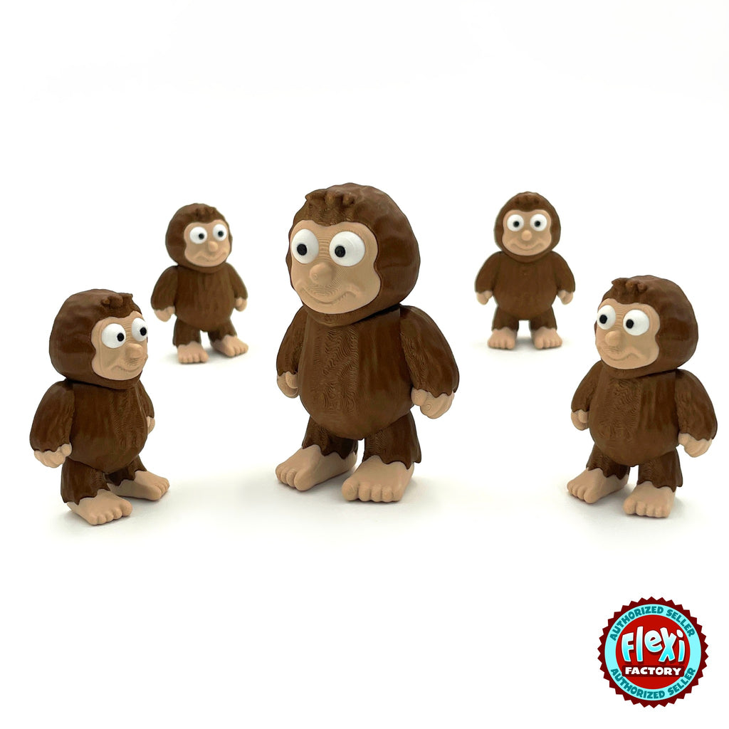 Cute sasquatch Bigfoot keychain, 3D printed by RU3D – group of sasquatches. Dark brown fur with tan face and feet.