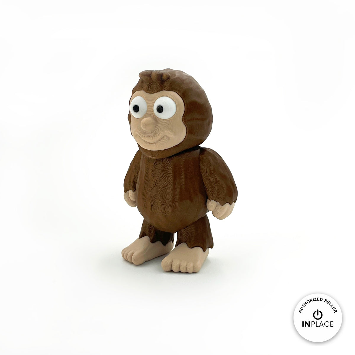 Cute sasquatch Bigfoot keychain, 3D printed by RU3D – three quarter view facing left. Dark brown fur with tan face and feet.