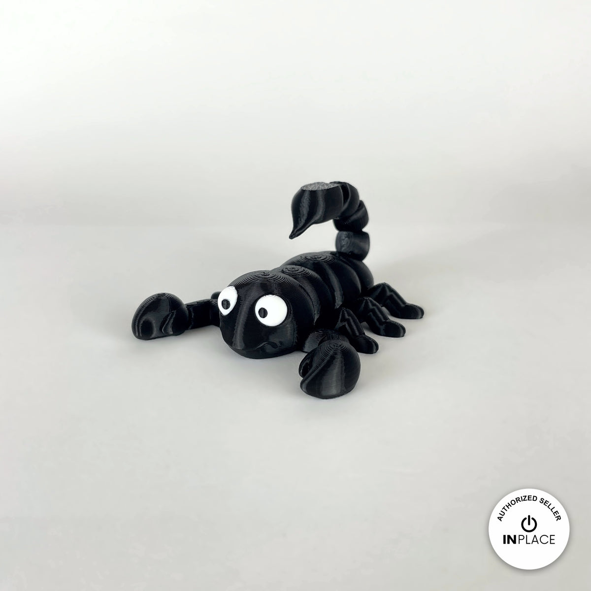 Cute scorpion keychain, 3D printed by RU3D – black three quarter view facing left. Black, also in tan brown.