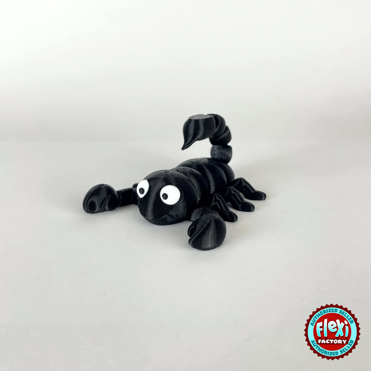 Cute scorpion keychain, 3D printed by RU3D – black three quarter view facing left. Black, also in tan brown.