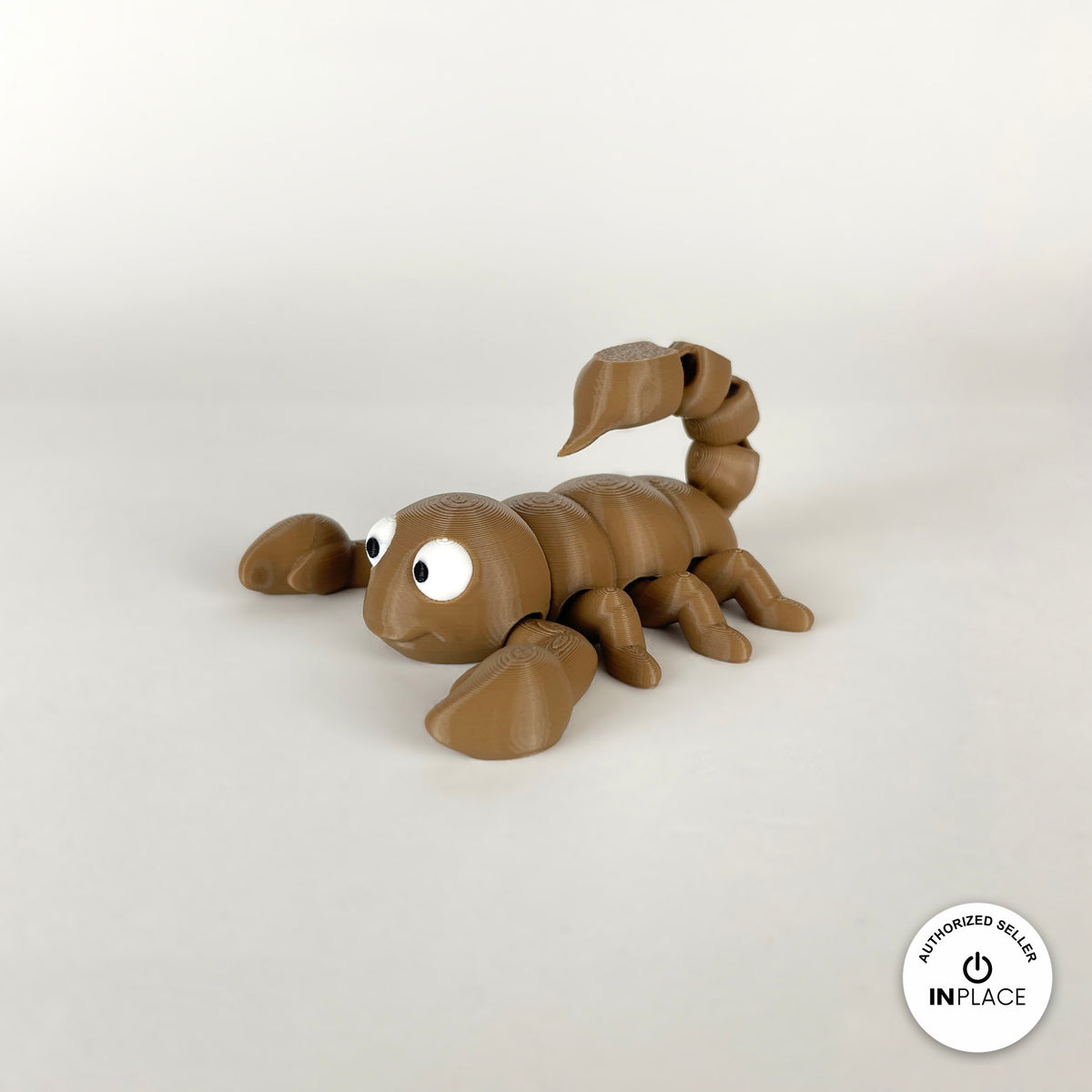 Cute scorpion keychain, 3D printed by RU3D – tan three quarter view facing left. Black, also in tan brown.