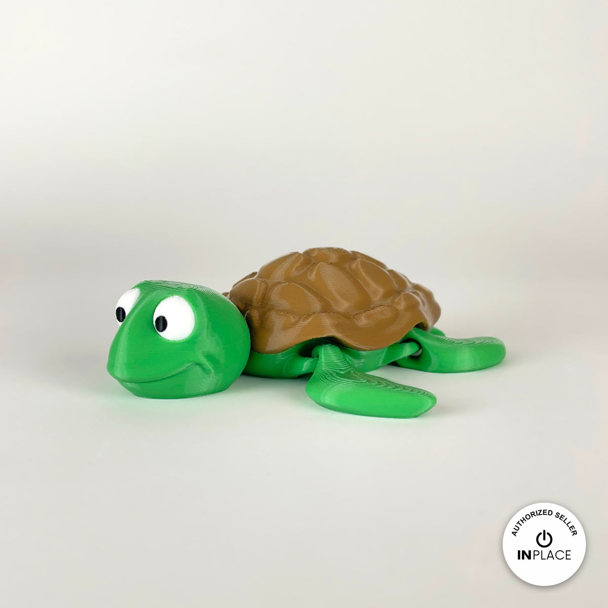 Cute sea turtle keychain, 3D printed by RU3D – three quarter view facing left. Green with brown shell.