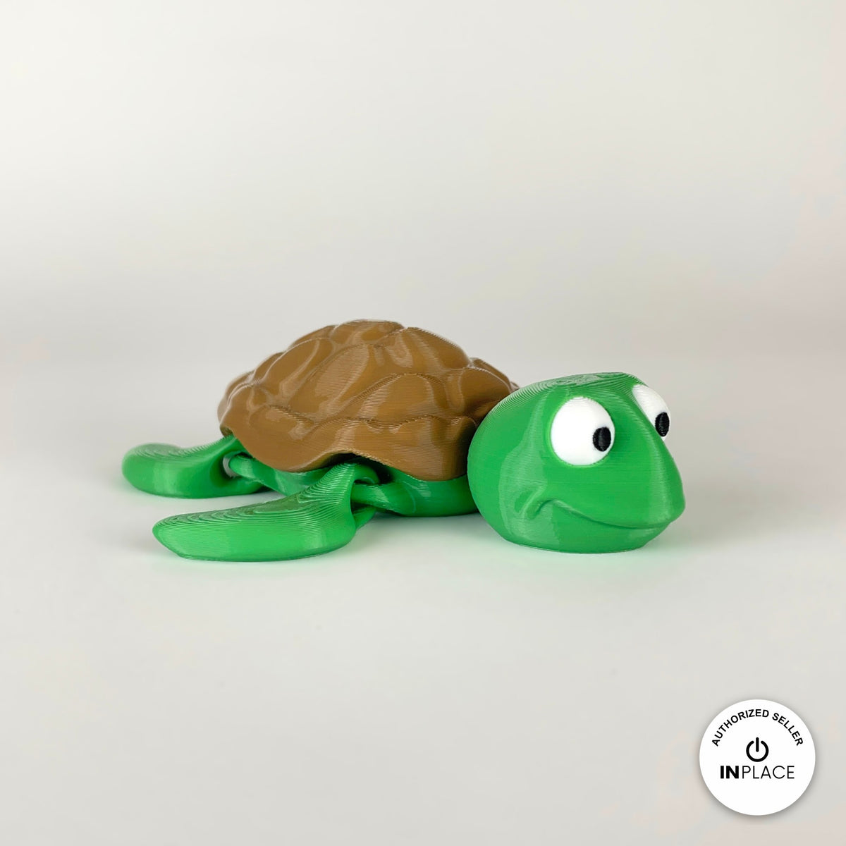 Cute sea turtle keychain, 3D printed by RU3D – three quarter view facing right. Green with brown shell.