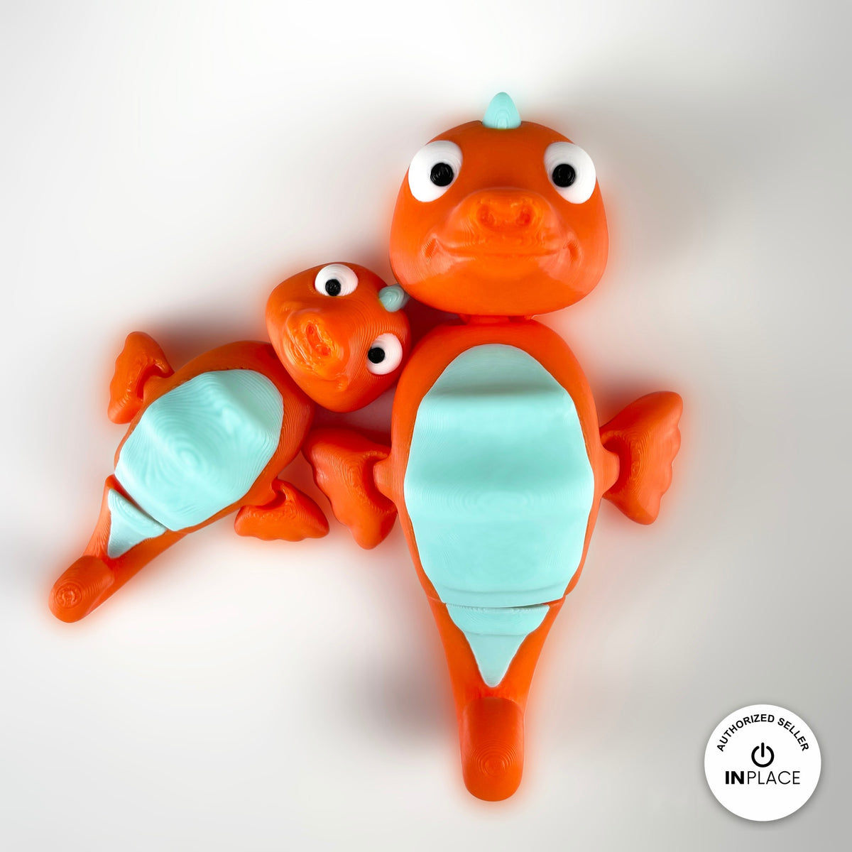 Cute seahorse keychain, 3D printed by RU3D – orange seahorse pair close up. Orange with mint belly, also pink and yellow.