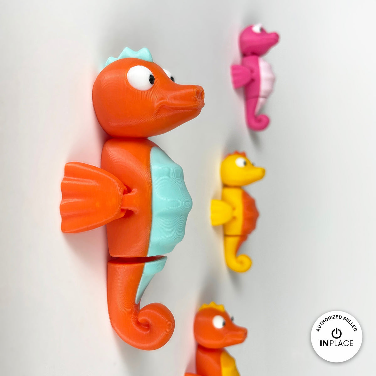 Cute seahorse keychain, 3D printed by RU3D – orange seahorse with friends. Orange with mint belly, also pink and yellow.