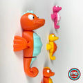 Cute seahorse keychain, 3D printed by RU3D – orange seahorse with friends. Orange with mint belly, also pink and yellow.