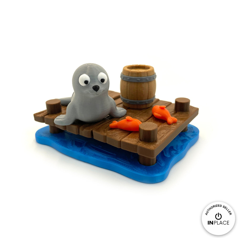 3D printed harbour dock platform by RU3D, shown with the Seal keychain