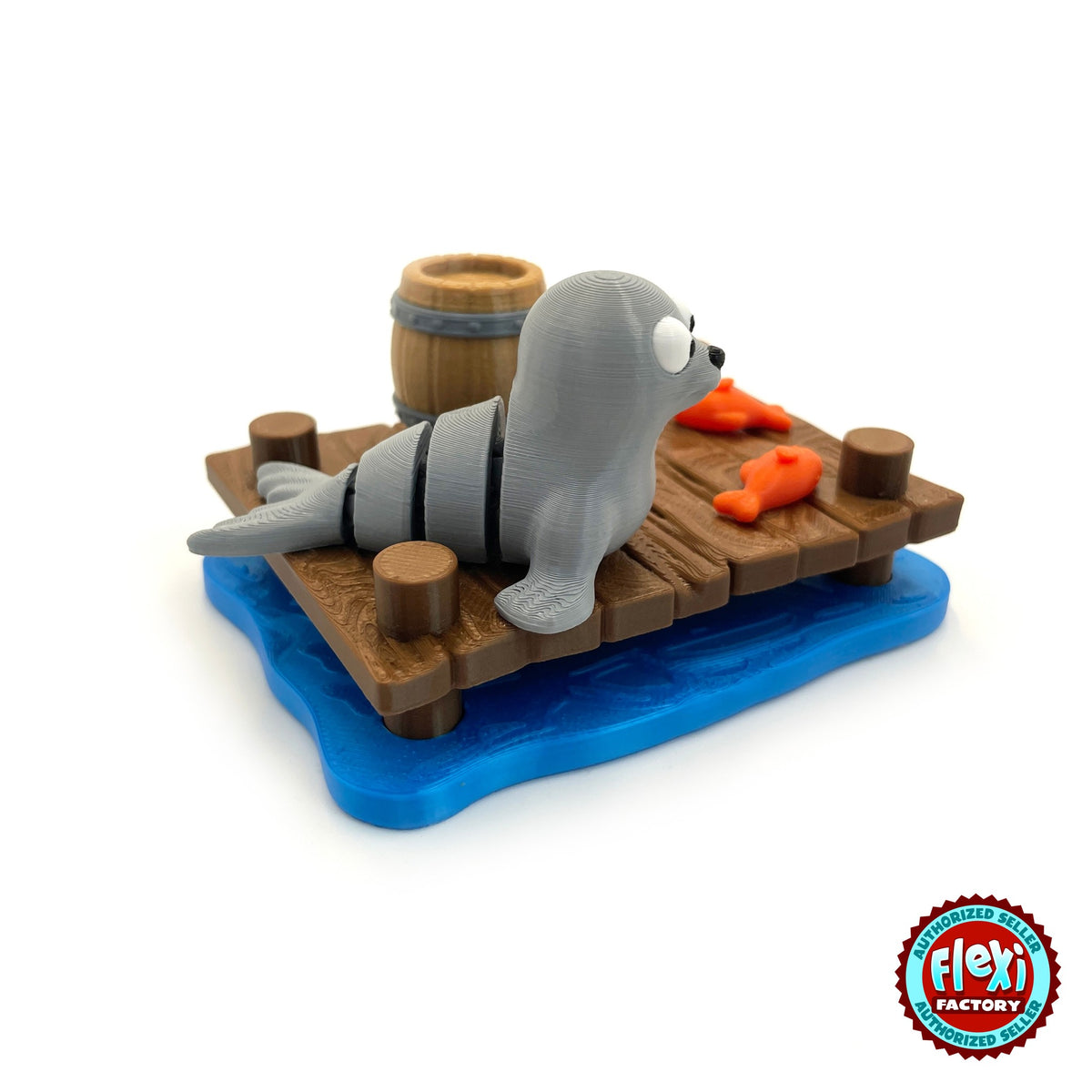 Cute seal keychain, 3D printed by RU3D – side view on wooden dock. Grey with wooden dock playset.
