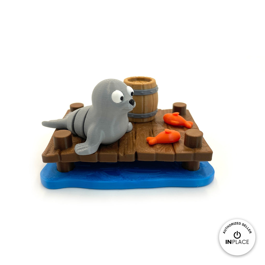 3D printed harbour dock platform by RU3D, shown with the Seal keychain