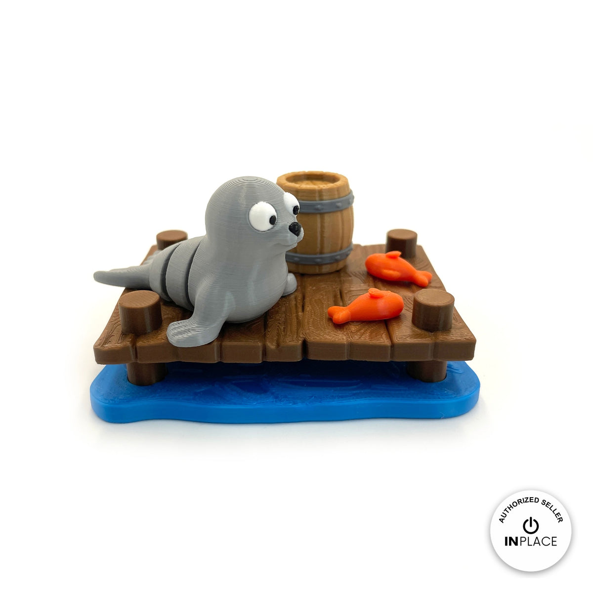3D printed harbour dock platform by RU3D, shown with the Seal keychain