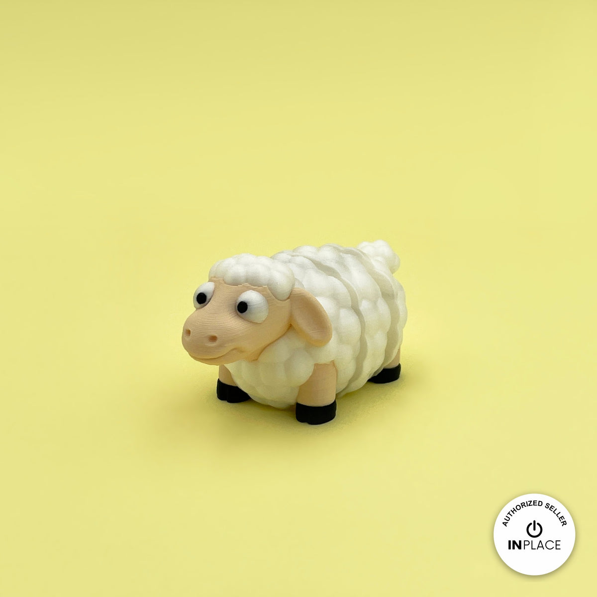 Cute sheep keychain, 3D printed by RU3D – three quarter view facing left. Cream fluffy wool with black hooves.
