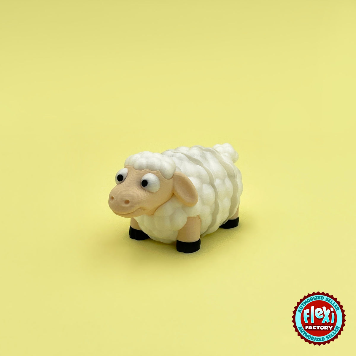 Cute sheep keychain, 3D printed by RU3D – three quarter view facing left. Cream fluffy wool with black hooves.