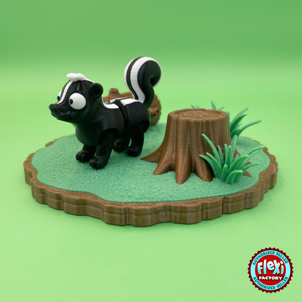 Cute skunk keychain, 3D printed by RU3D – three quarter view by tree stump. Black and white with woodland log playset.