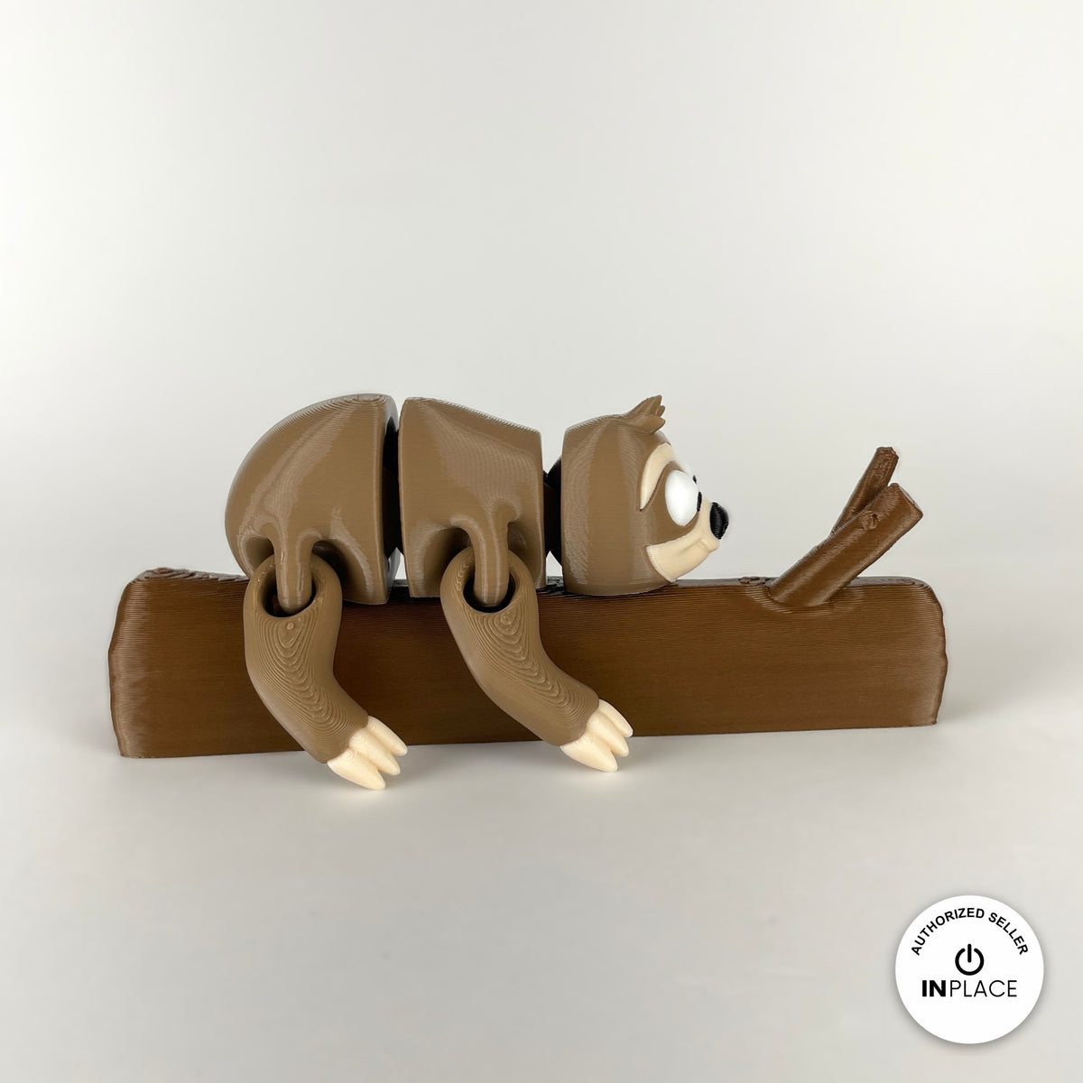 3D printed tree branch accessory by RU3D, shown with the Sloth keychain