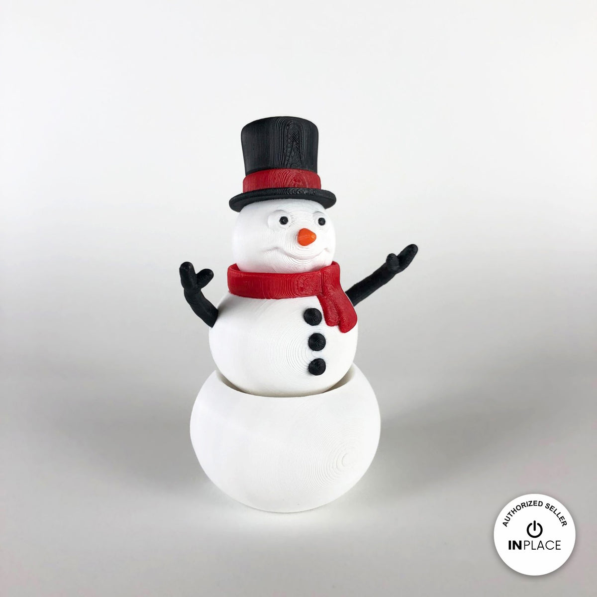 Cute snowman keychain, 3D printed by RU3D – three quarter view facing left. White with black top hat and red scarf.