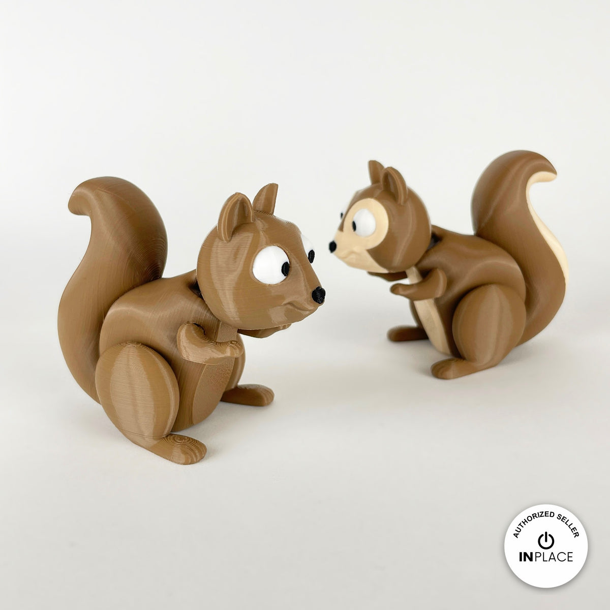 Cute squirrel keychain, 3D printed by RU3D – pair of squirrels face to face. Brown with cream belly and acorns.