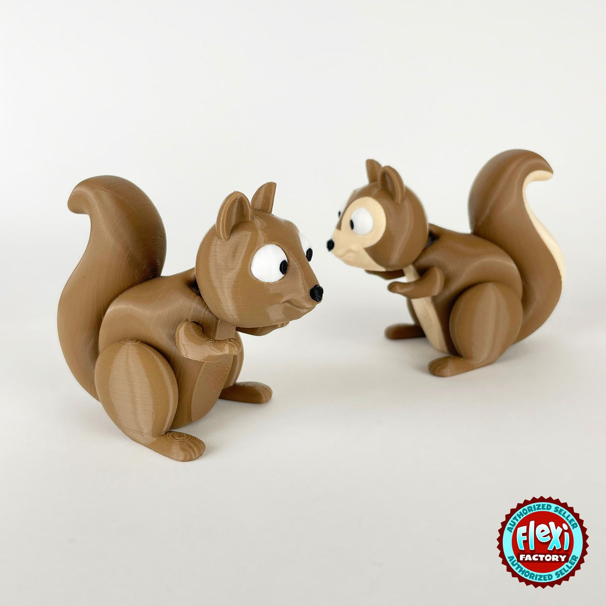 Cute squirrel keychain, 3D printed by RU3D – pair of squirrels face to face. Brown with cream belly and acorns.