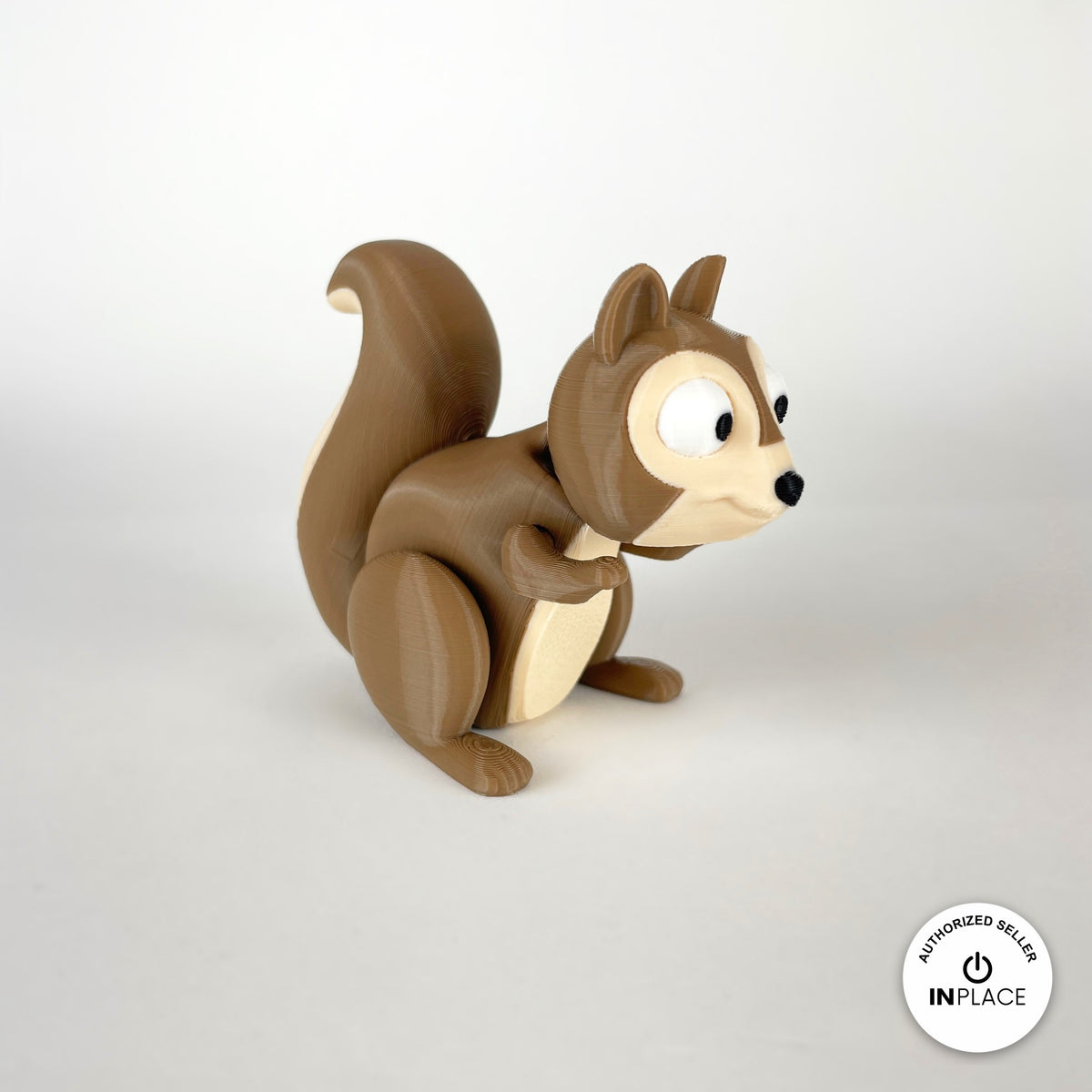 Cute squirrel keychain, 3D printed by RU3D – three quarter view facing right. Brown with cream belly and acorns.