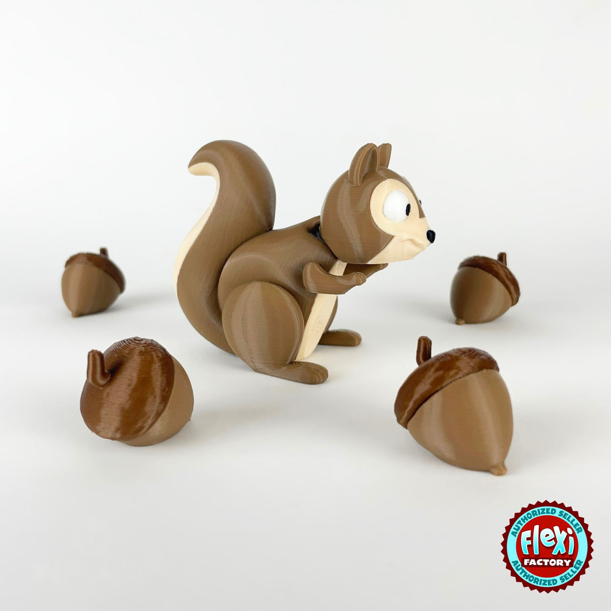 Cute squirrel keychain, 3D printed by RU3D – with acorns facing right. Brown with cream belly and acorns.