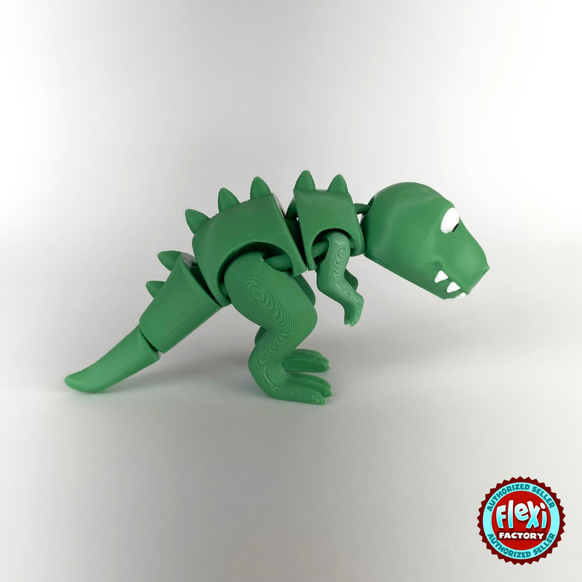 Cute T Rex dinosaur keychain, 3D printed by RU3D – side view facing right no spikes. Green with orange spikes.