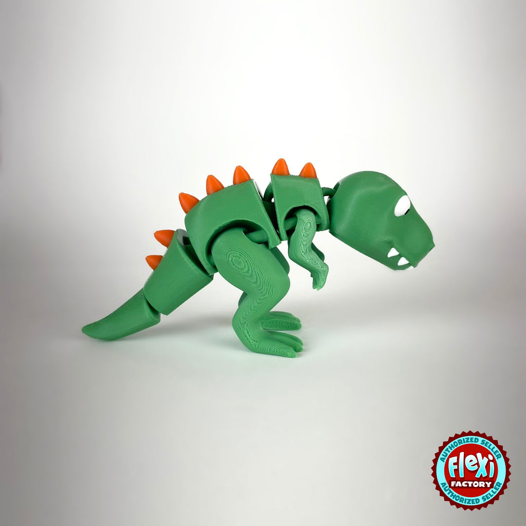 Cute T Rex dinosaur keychain, 3D printed by RU3D – side view facing right. Green with orange spikes.