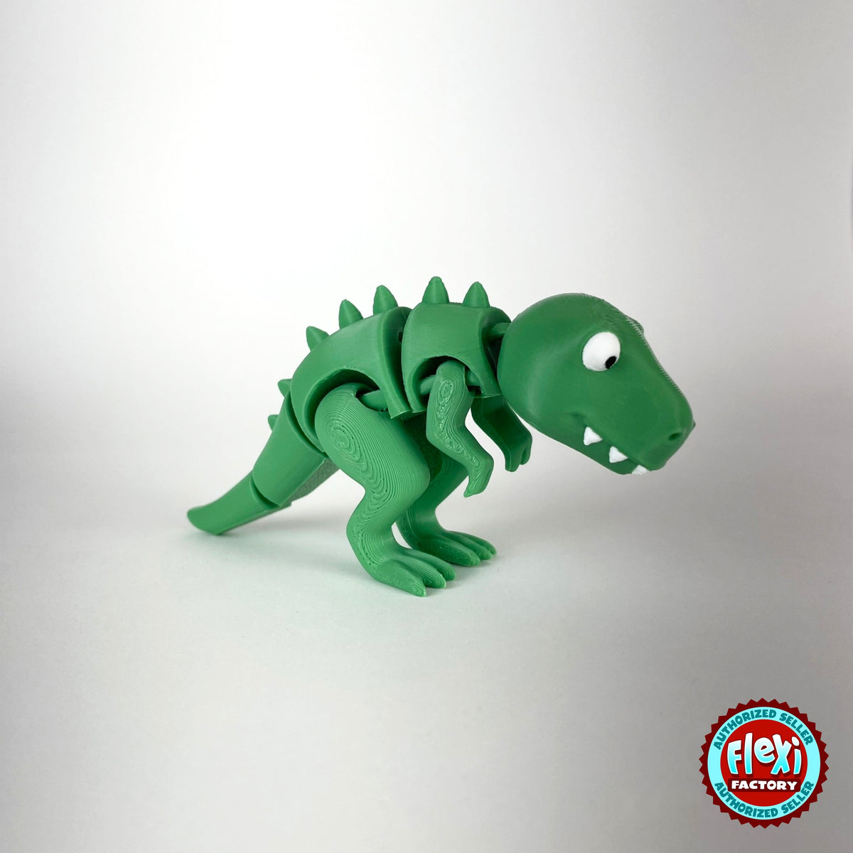 Cute T Rex dinosaur keychain, 3D printed by RU3D – three quarter view facing right no spikes. Green with orange spikes.