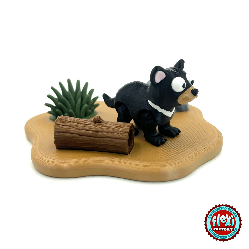 Cute Tasmanian devil keychain, 3D printed by RU3D – side view on habitat playset. Black with white chest and pink ears, outback habitat playset.