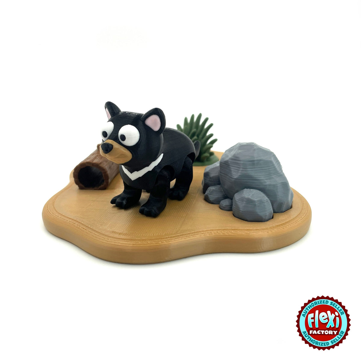 Cute Tasmanian devil keychain, 3D printed by RU3D – three quarter view on habitat playset. Black with white chest and pink ears, outback habitat playset.