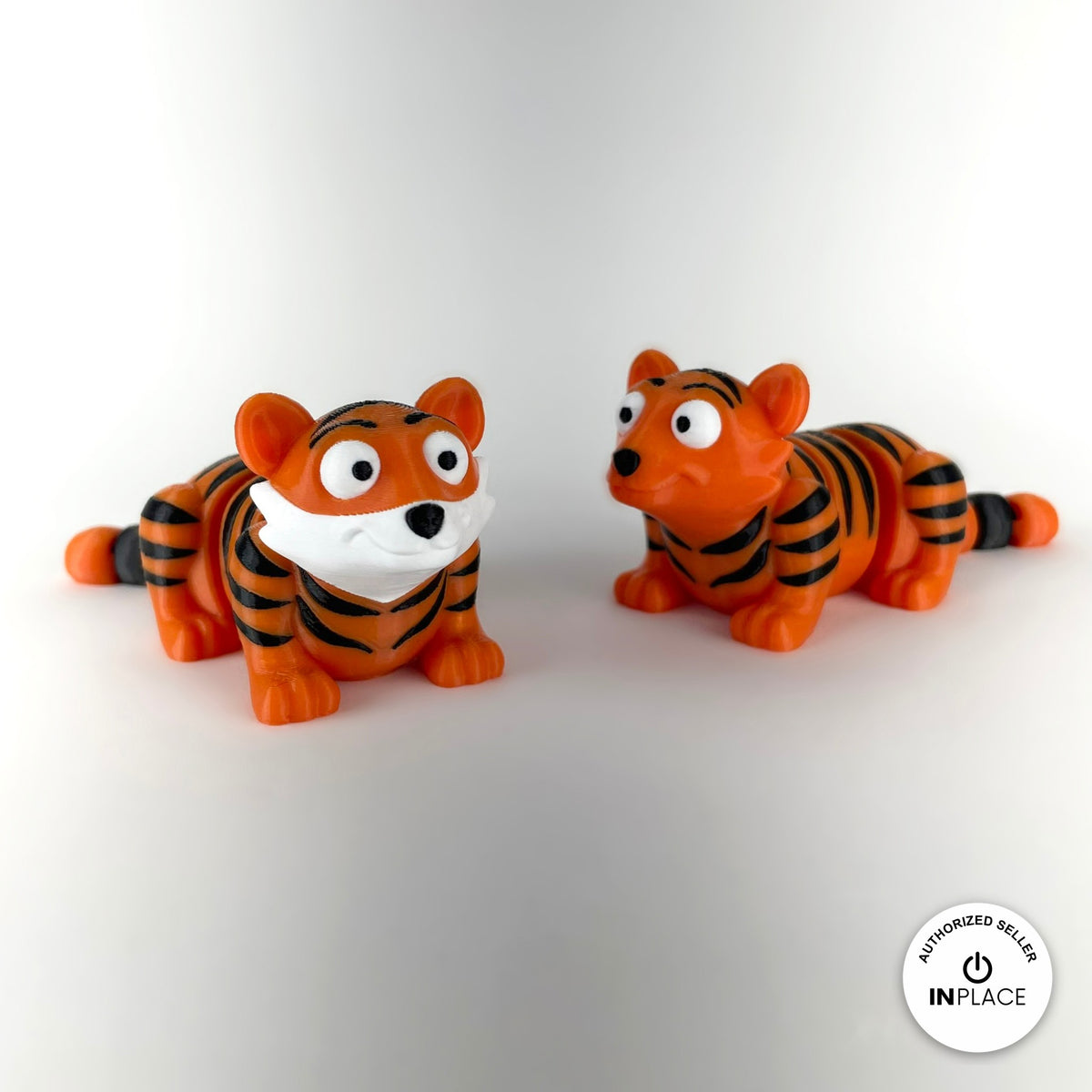 Cute tiger keychain, 3D printed by RU3D – pair of tigers front view. Orange with black stripes.