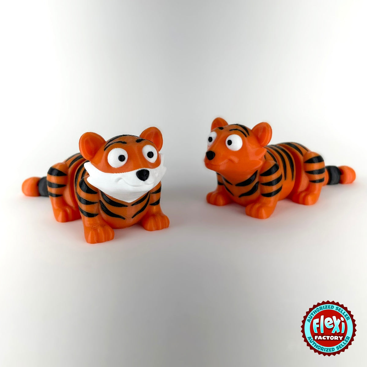 Cute tiger keychain, 3D printed by RU3D – pair of tigers front view. Orange with black stripes.