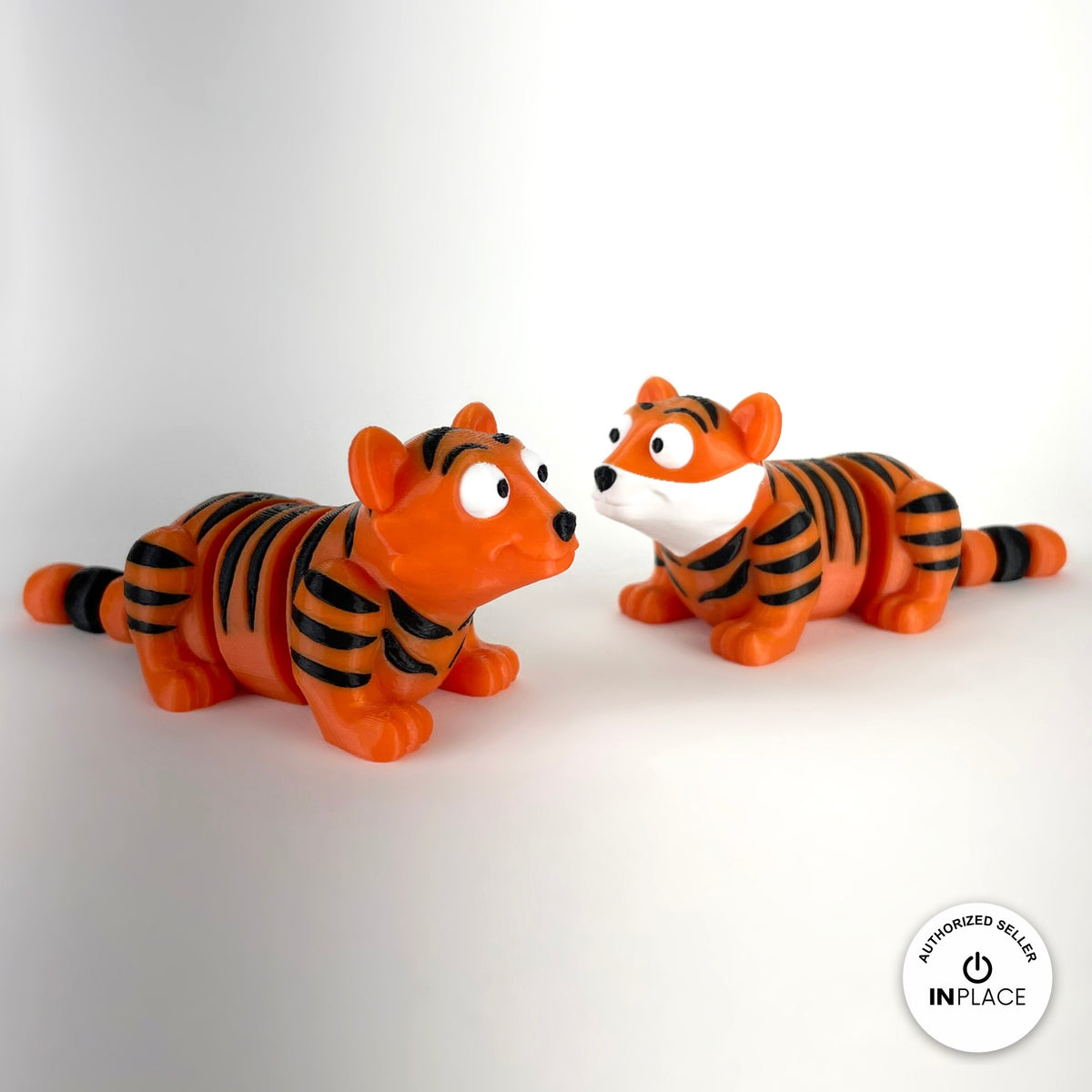 Cute tiger keychain, 3D printed by RU3D – pair of tigers. Orange with black stripes.