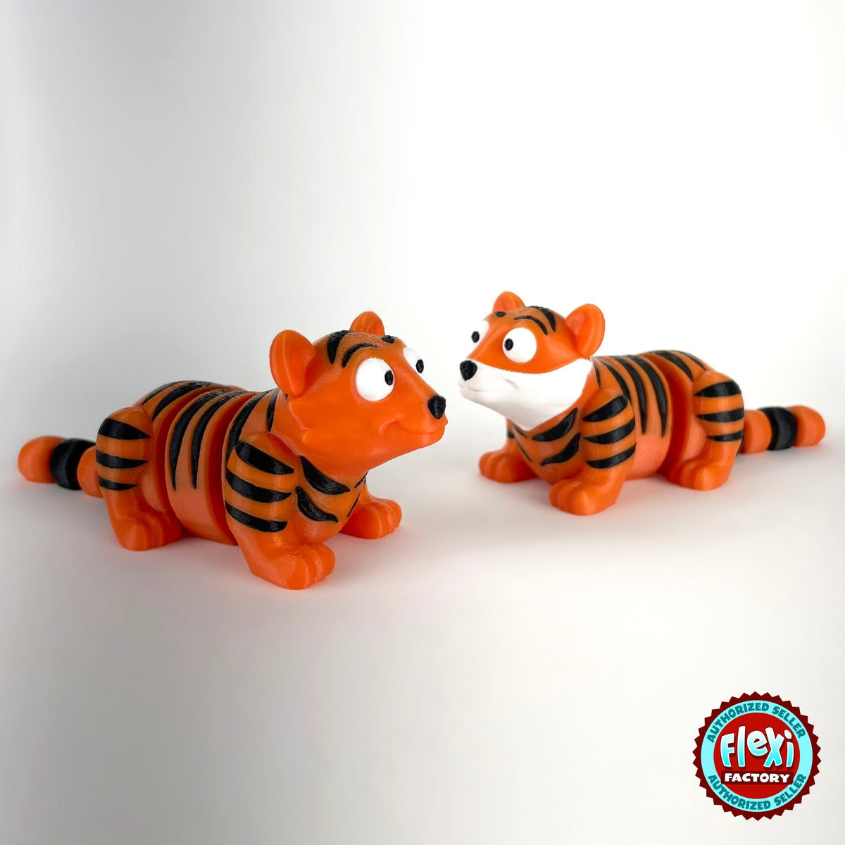 Cute tiger keychain, 3D printed by RU3D – pair of tigers. Orange with black stripes.