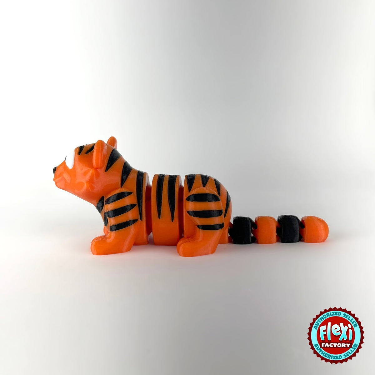 Cute tiger keychain, 3D printed by RU3D – side view facing left. Orange with black stripes.