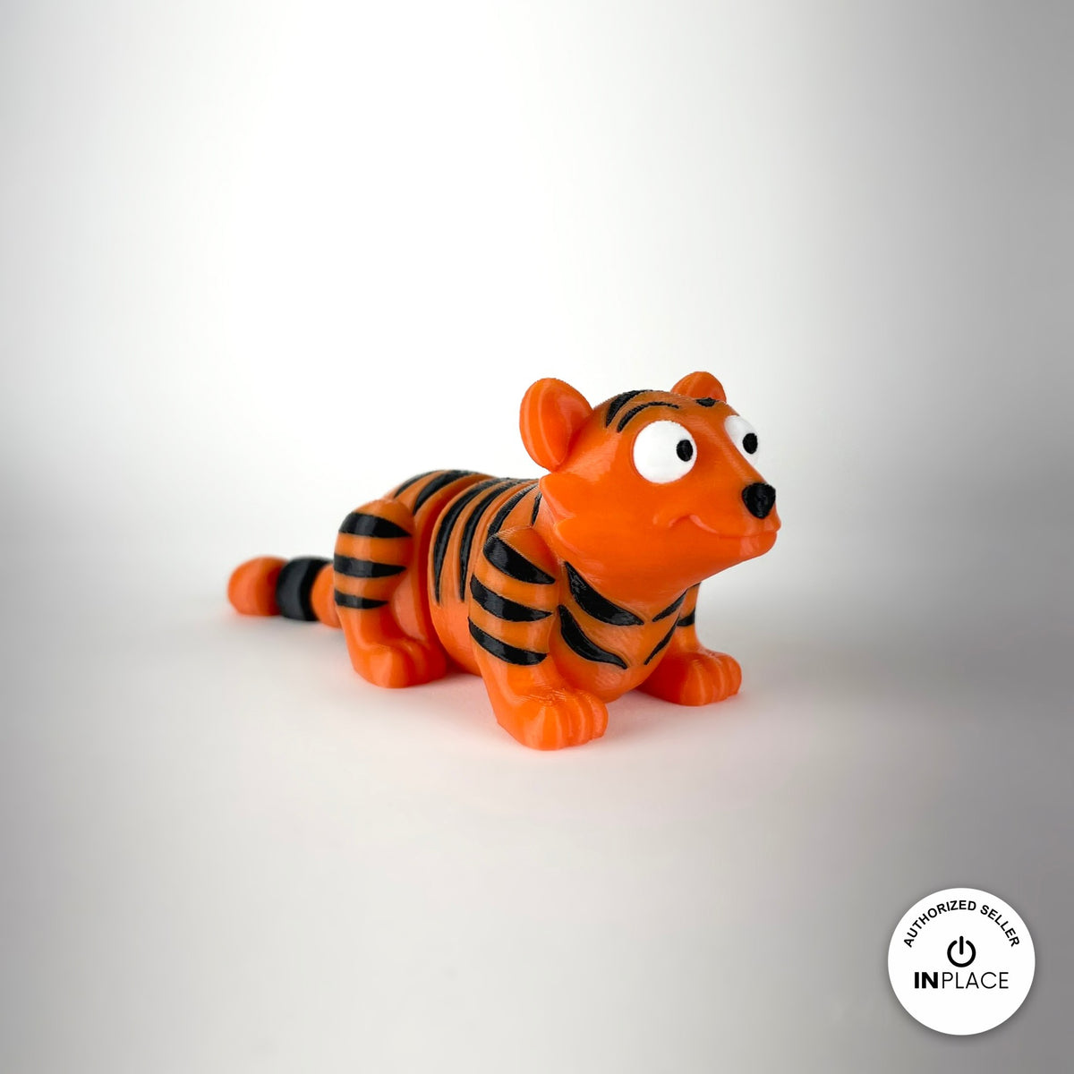 Cute tiger keychain, 3D printed by RU3D – three quarter view facing right. Orange with black stripes.