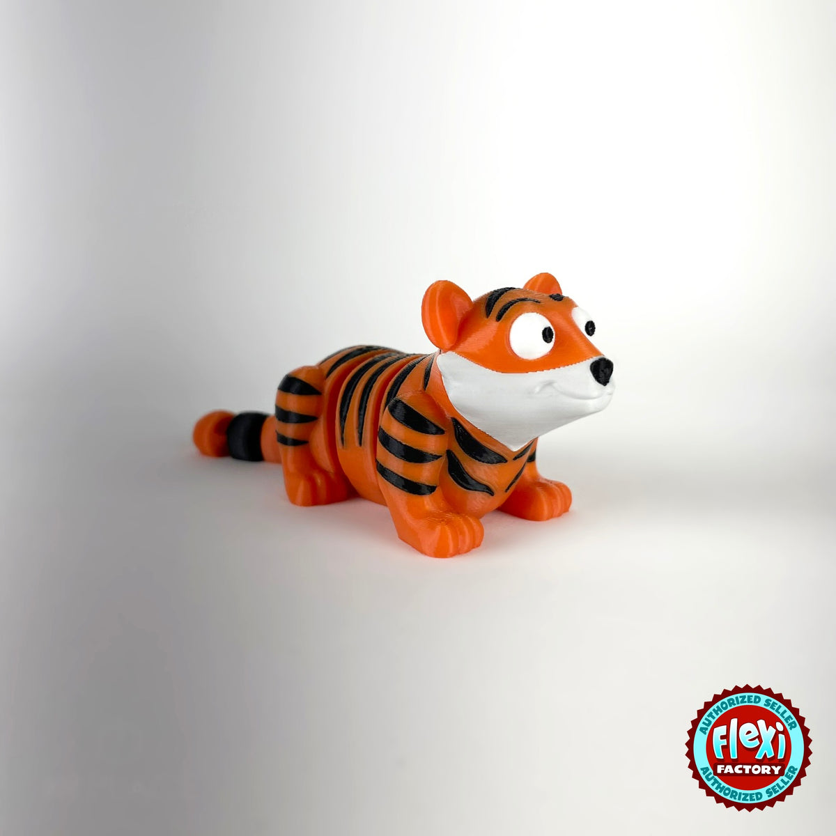 Cute tiger keychain, 3D printed by RU3D – white face three quarter view facing right. Orange with black stripes.